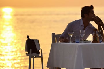 Couple dining on adult-only beach