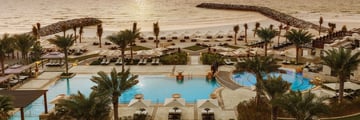 The Pool and beach at Ajman Saray, A Luxury Collection Resort