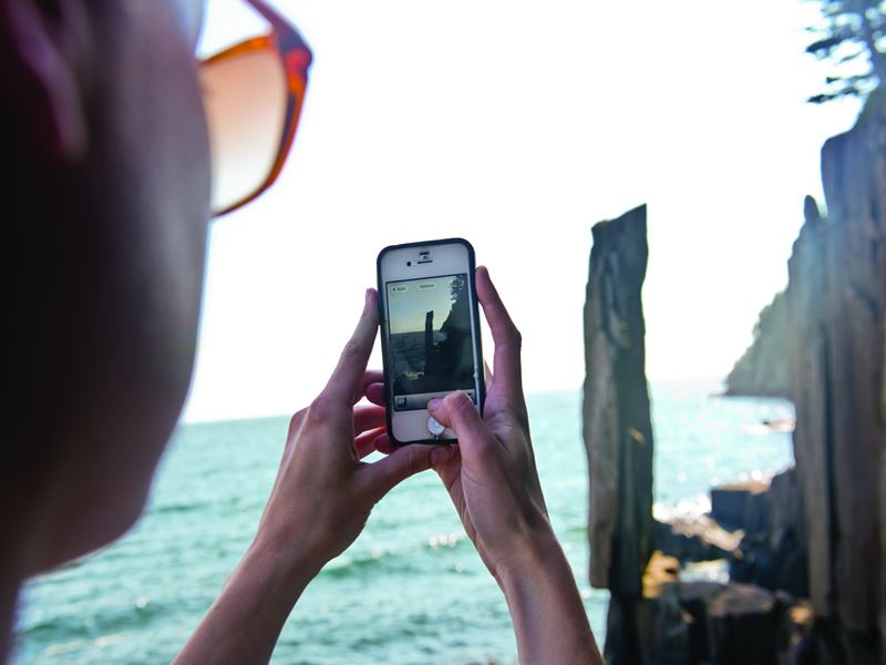 Taking photos of Balancing Rock, Bay of Fundy