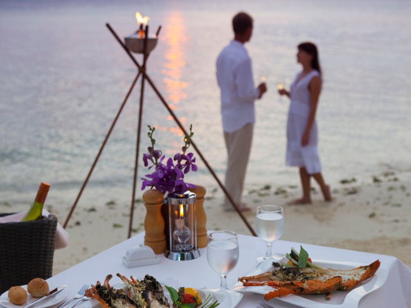 dining on beach at Baros Maldives