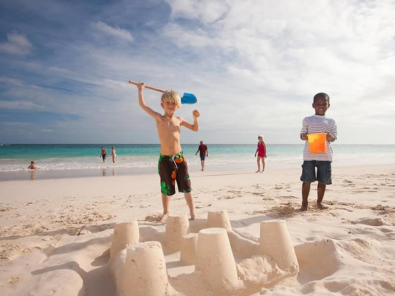 Building sandcastles on the beach at Bougainvillea Resort