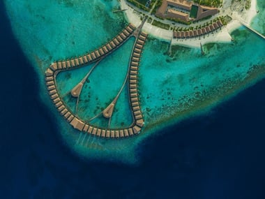 Aerial view of Water Bungalows at Cinnamon Velifushi Maldives