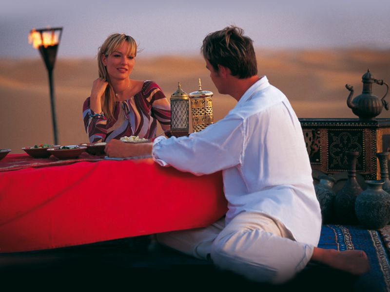 Couple dine in the Dubai desert