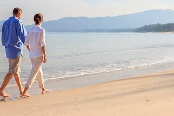 Couple walking along the beach