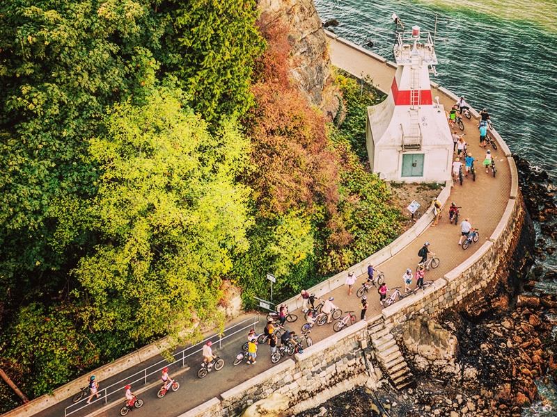 Cyclists make their way around Stanley Park Seawall