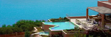 Pool and sea views at Domes of Elounda