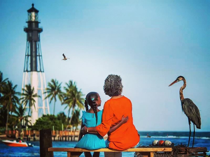 Family enjoying the coast near Hillsboro Lighthouse