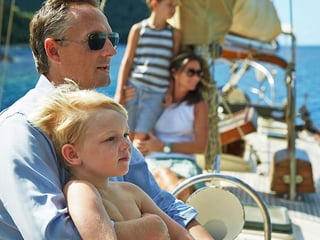 Family sailing in the waters by Sugar Beach by Viceroy
