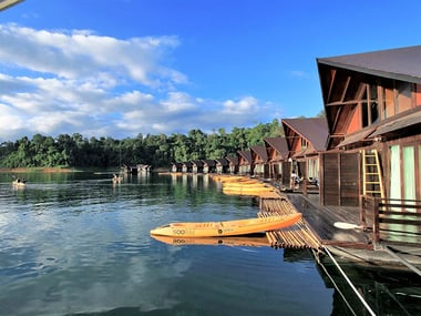 Floating bungalows on a lake with kayaks