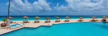 Pool and Loungers at Frangipani Beach Hotel