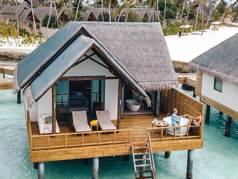 couples in water villa at Fushifaru Maldives