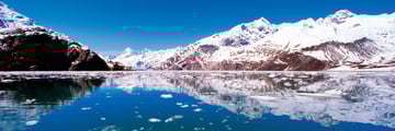 Reflection of Glacier Bay, Alaska over the water