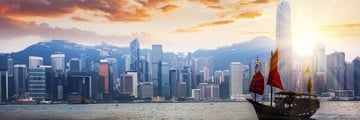 Hong Kong skyline and traditional junk boat