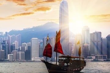 Hong Kong skyline and traditional junk boat
