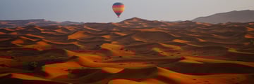 hot air balloon over desert dubai
