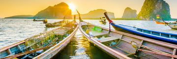 Long boats at sunset in Krabi