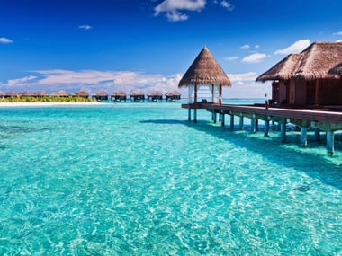 Maldives lagoon with overwater cabins