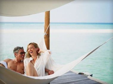The happy couple relaxing on the beach