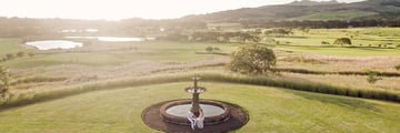 Married couple sitting by the fountain, Heritage Awali