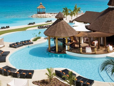 Outdoor pool and sun terrace at Secrets Wild Orchid