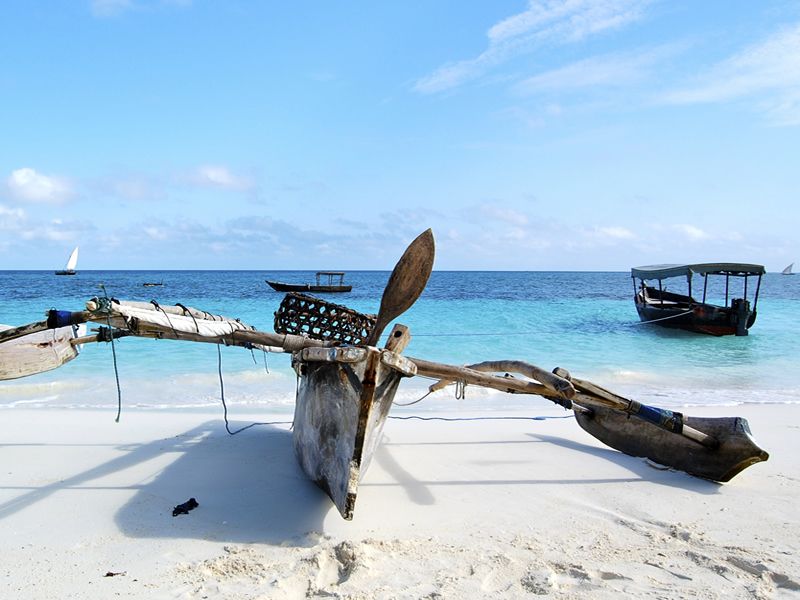 Outrigger canoe on a Zanzibari white sand beach