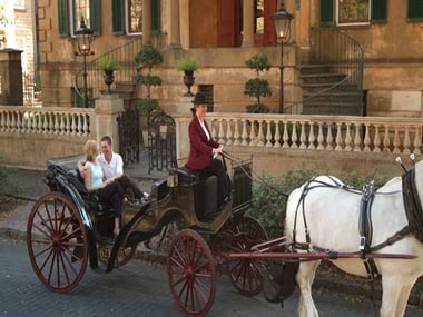 Romantic carriage ride around hotel exterior, Savannah