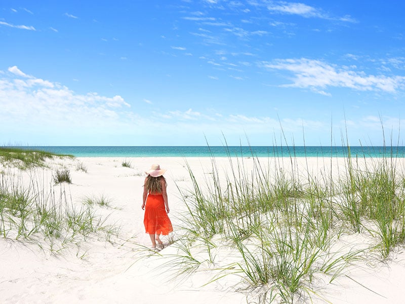 woman on shell island beach