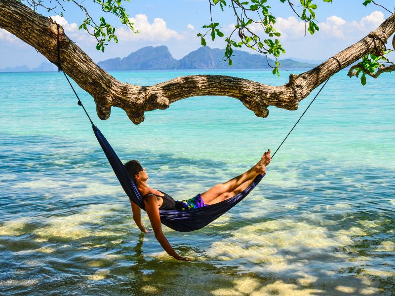 Relax on a hammock surrounded by tropical scenery