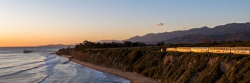 Sunset views onboard Amtrak Surfliner train along the Californian Coast