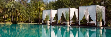 Swimming pool cabanas at The Sarojin Khao Lak