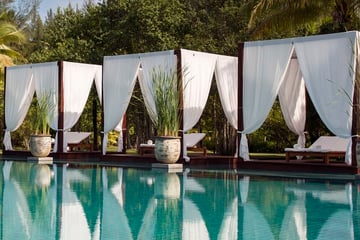 Swimming pool cabanas at The Sarojin Khao Lak