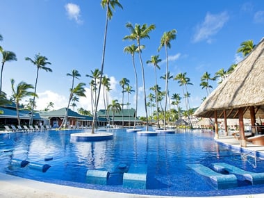 Swimming pool with loungers at Barcelo Bavaro Beach