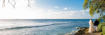 Bride and groom on beach at The Club Barbados Resort & Spa