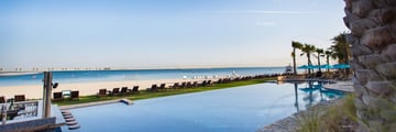 JA Palm Tree Court pool and beach