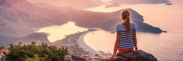 Young woman overlooking Fethiye at sunset