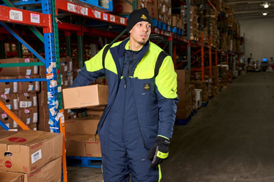 A man working in hivis workwear in a warehouse