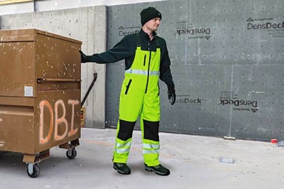 A man working in hivis outside.