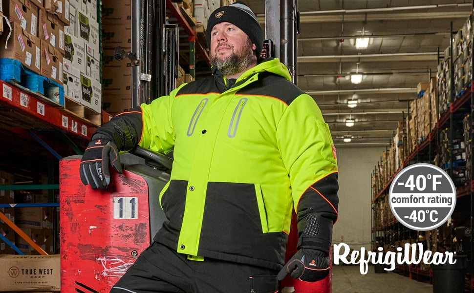 Man standing in a cold storage warehouse wearing HiVis PolarForce Jacket