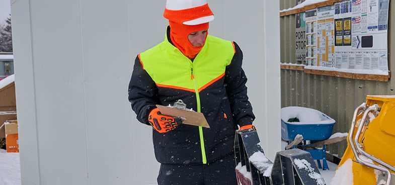 Person wearing FrostFlex, working in the snow