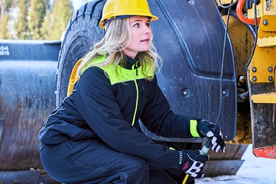 A woman working in hivis PPE.