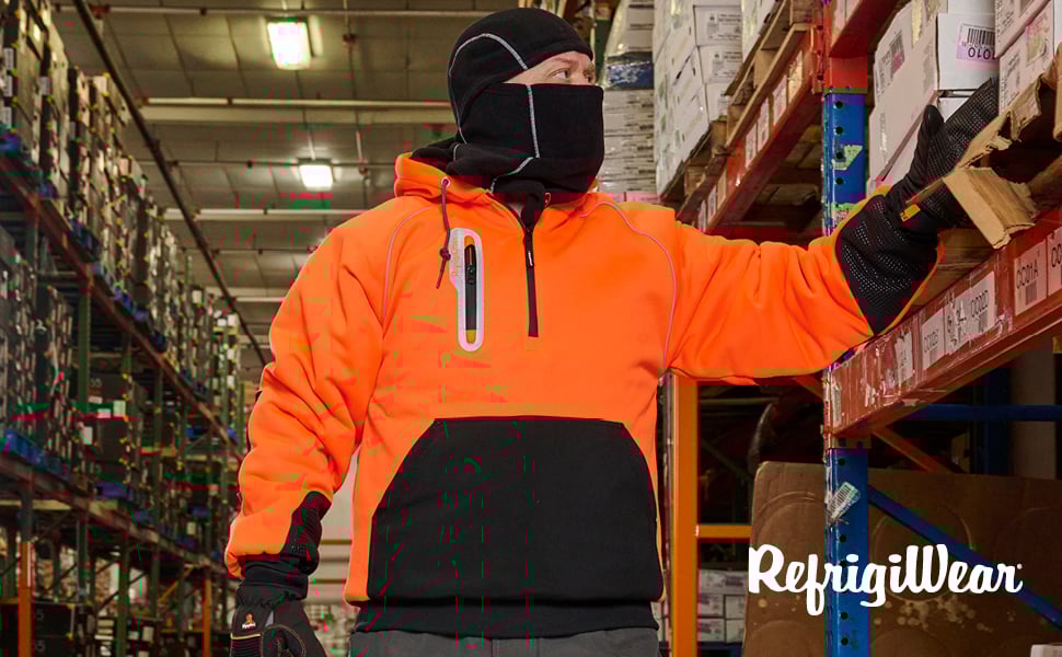 Man standing in a cold storage warehouse wearing HiVis PolarForce Jacket