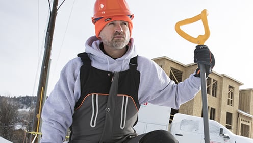 Man in Refrigiwear working in the snow.