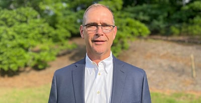 A man standing in an open field.