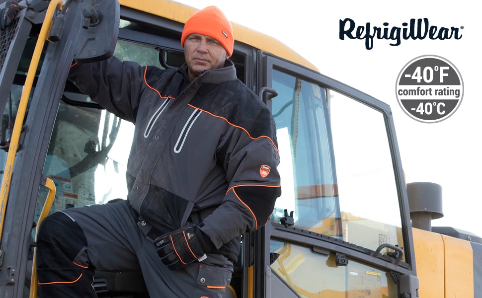 Man working on heavy equipment wearing PolarForce Jacket