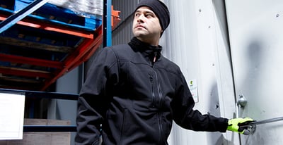 A woman outside working in Iron Tuff work wear.