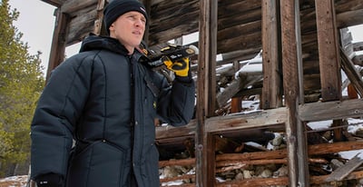A man preparing for work in refrigiwear workwear.