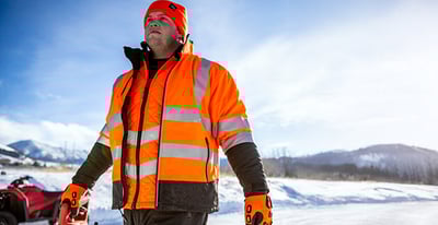 A man outdoors in hivis lightweight softshell jacket