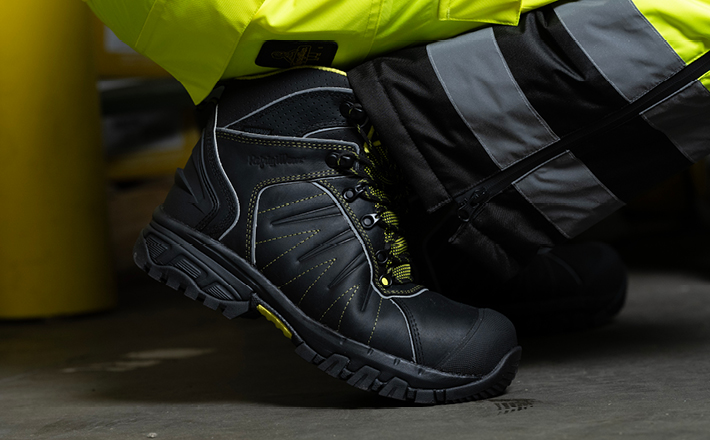 Man kneeling wearing RefrigiWear OnxyRidge Hikers