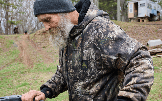 Man wearing RefrigiWear x Realtree APX Camo Sweatshirt