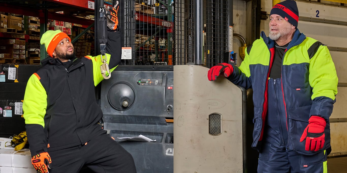 Two people working in a cold storage warehouse wear insulated PPE from the RefrigiWear family of brands.